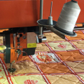 Single needle quilting machine